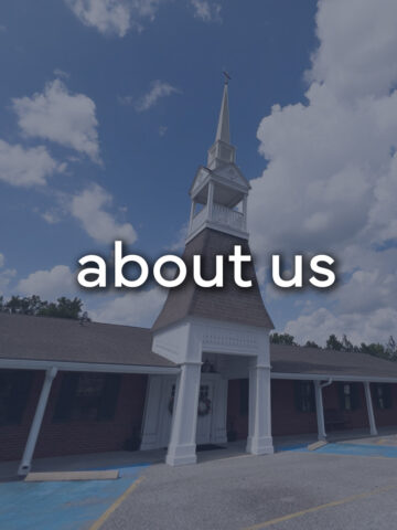 brick church with the words "about us".