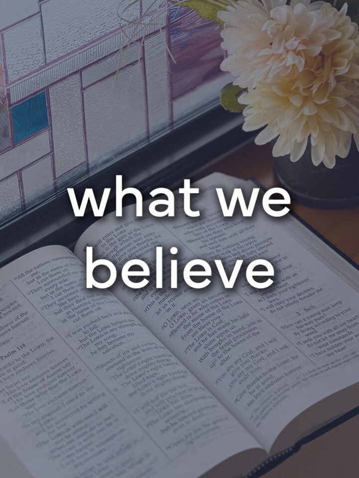 an open Bible with the words "what we believe".